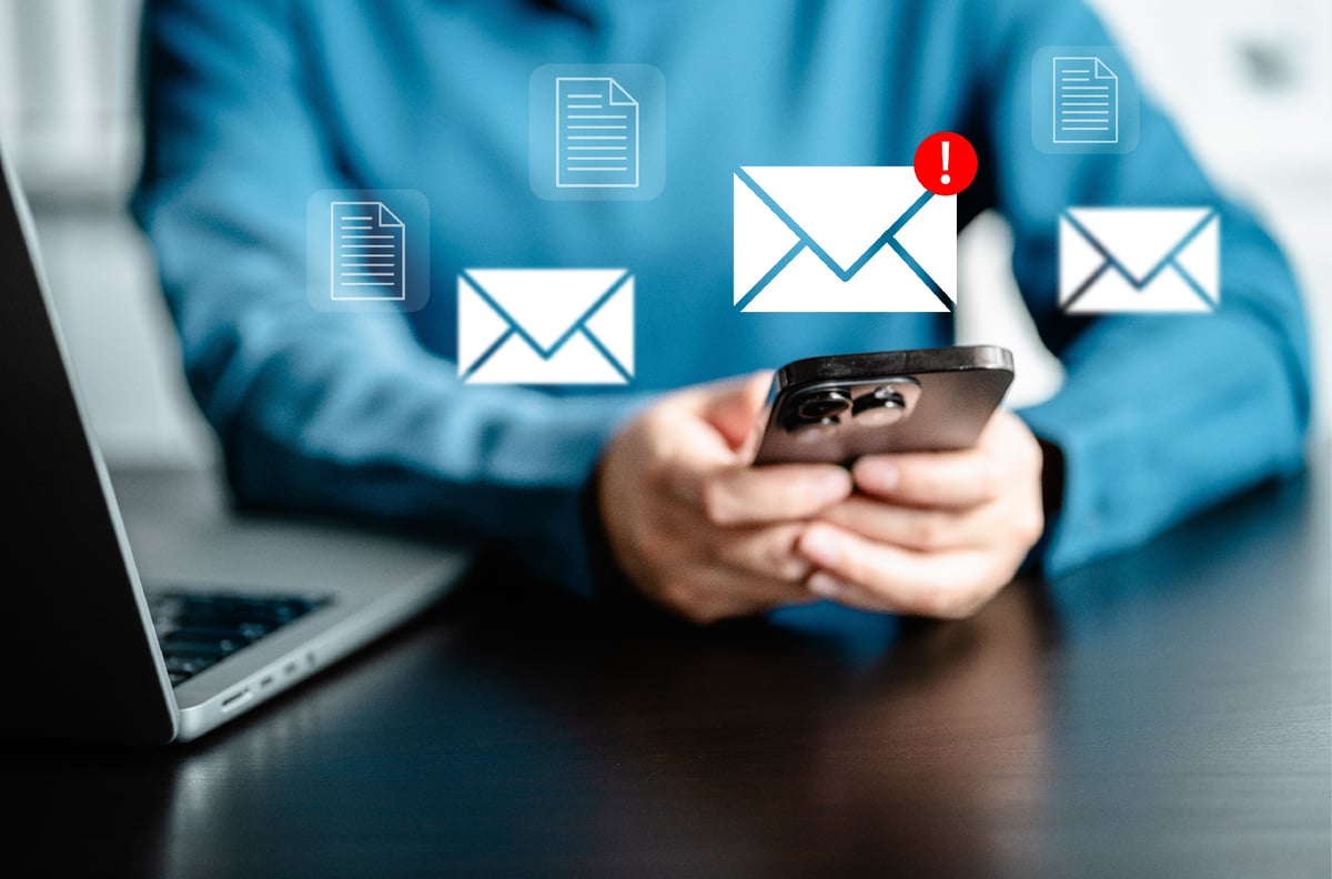 Businesswomen checking email via smartphone